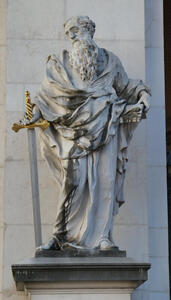 Man with long beard in Greek/Roman robe. In one hand, a sword with a gold hilt. In the other hand, a book.
