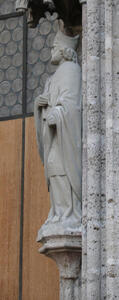 Side view of ancient statue of a cleric