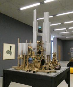 Another model of a “modern above/squalid below” building.