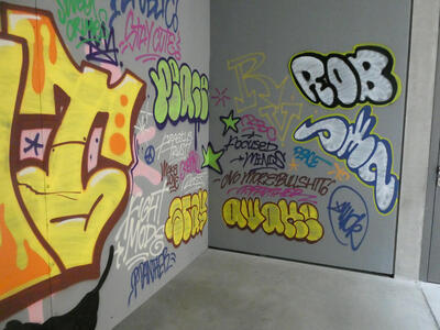 Pseudo-graffiti with sayings like Stay Cute, Focused Mends, No more bullshit, and Make Love