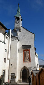 Long view of fortress clock tower and ancient plaque