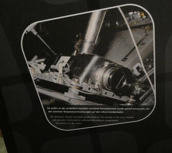 Picture of camera attached to leg of lunar lander.