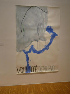 Large drawing on paper; a man, head downwards, with blue trails emitted from the mouth. Text: VOMITÉ DE NUEVO