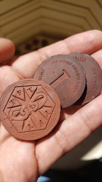 Tokens showing both sides