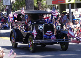 Antique car with “googly eyes“ on headlights