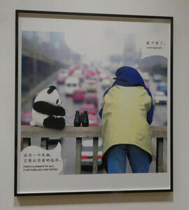 Man and toy panda with binoculars on bridge; panda says “Here’s a present for you, it will make you lok farther.  Man says “I am laid off.”