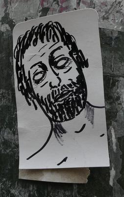 Black pen drawing of head of a bearded man with eyes rolling back.
