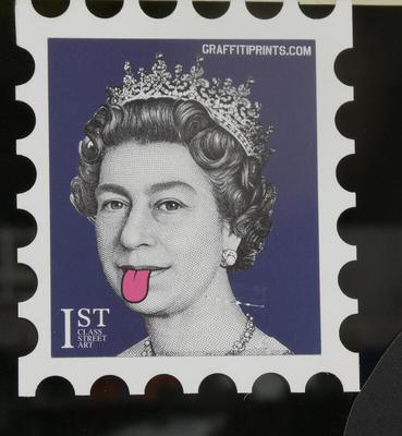 Postage stamp of Queen Elizabeth 2, drawn on her face is a tongue sticking out.