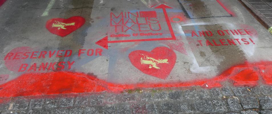 Stencilled letters on sidewalk: Reserved for Banksy and other talents!