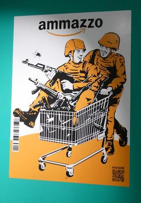 Take-off of amazon logo, renamed ammazzo. Picture of a soldier pushing a shopping cart. In the cart, another soldier holding a gun. Shopping cart is also filled with guns.