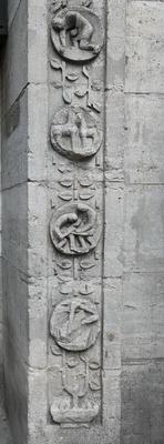 Circular carved images of workers