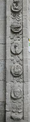 Circular carvings of people and animals