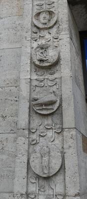 Circular carvings of birds and people