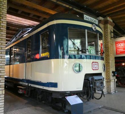 Deutsche Bahn train car; bottom is white, top is dark blue. Approximately late 1940s?