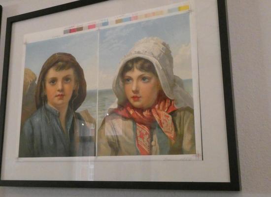 Print sample showing a boy and girl in traditional dress; a print color bar is at the top.