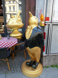 penguin waiter with bowl of ice cream