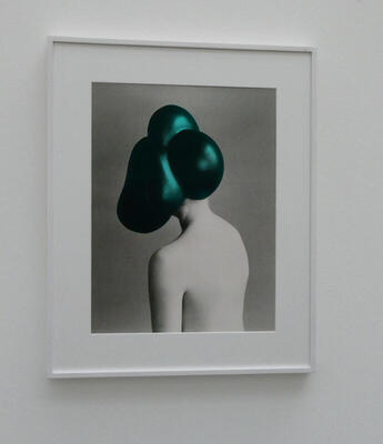 woman with head of green spheres