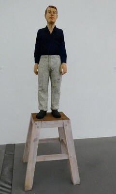 lifelike wooden sculpture of man