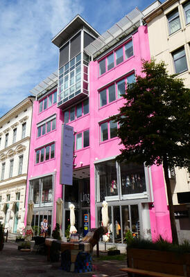 building with pink facade