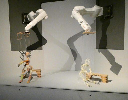 robot arm controlled marionettes