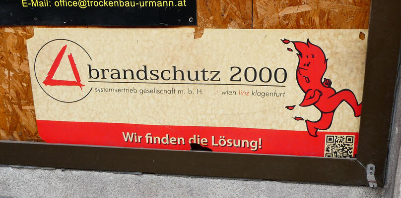 Sticker showing a flame running away from the company logo. brandschutz 2000 / Wir finden die Lösung!