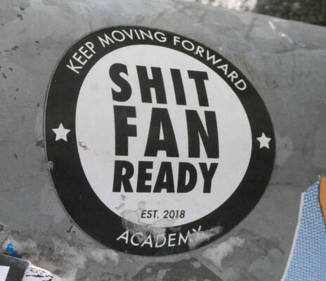 Inside circle: Shit fan ready est. 2018 around outside of circle: Keep Moving Forward Academy