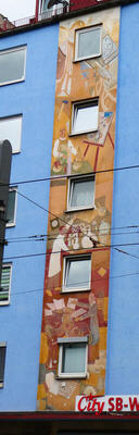 paintings of artist scientist printer on side of building