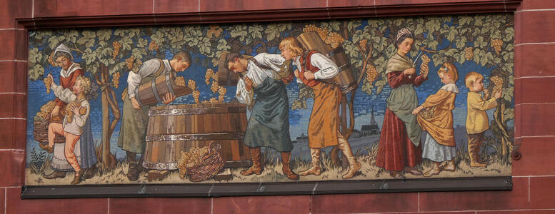 family harvesting grapes