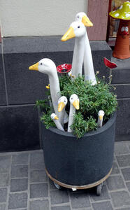 planter with heads of geese