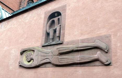 abstract sculpture on side of church