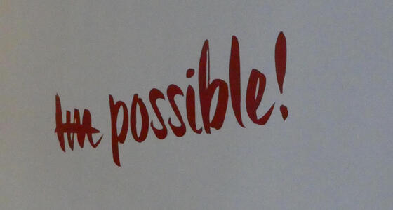 Im possible (with line striking out “Im”)