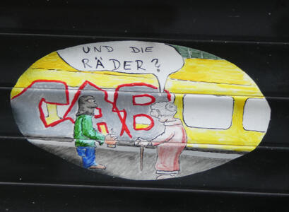 Old woman asking graffiti artist who is tagging a subway car “Und die Räder?”