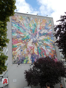 large abstract mural on building wall