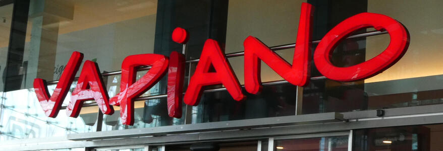 Sign reading “Vapiano” in red capital letters.