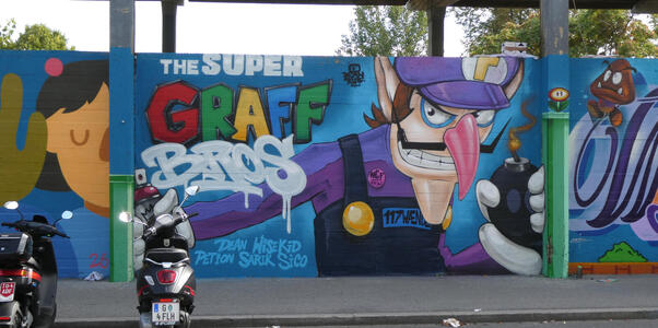 The SUPER GRAF Bros (Dean WiseKid/Petion Sarik Sico); with Waluigi holding a round bomb with lit fuse