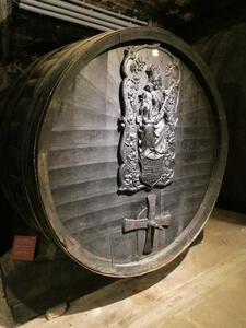 Large wine barrel with carving of virgin Mary holding baby Jesus