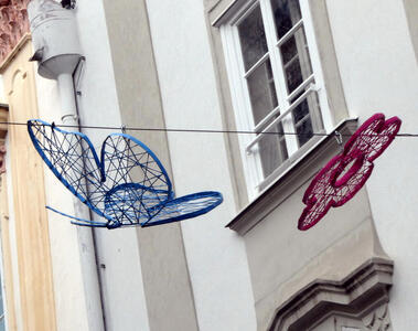 wire frame blue butterfly and red flower