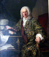 Man with white powdered wig in flowered robe