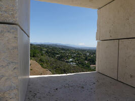 View of Los Angeles through a square “window” in the stonework of the building