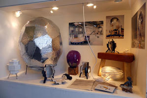 Model of steam egg in display case