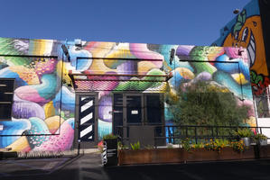 Storefront painted in bright pastel colors in abstract shapes