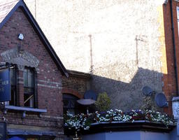 Top floor of restaurant with small garden on top of flat area on 2nd floor.