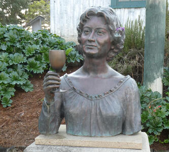 Bust of Kalisa Moore, the “Queen of Cannery Row”. Someone put a small purple flower near her ear.