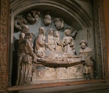 Women standing over body of crucified Jesus