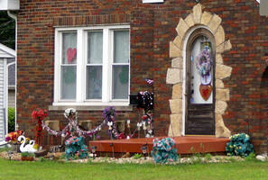 Variety of lawn decorations: flowers, swans