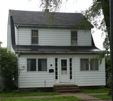 Two-story white wood house