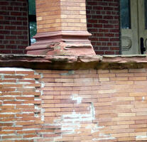 Crumbling brickwork under column