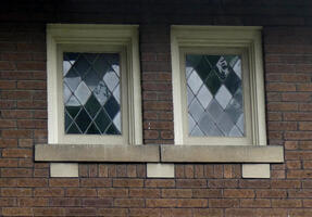 Windows with facets in shape of diamonds.