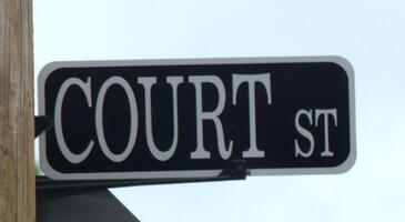 Street sign for Court Street in a serif font