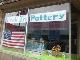 Front display window for “Peek In Pottery”